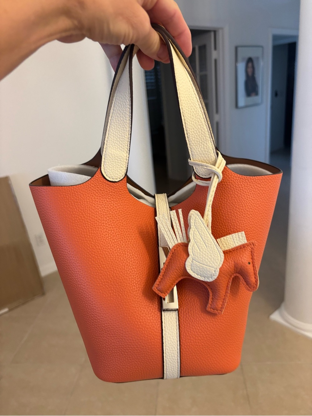 Orange and White Pebbled Leather Tote with Charm Accent